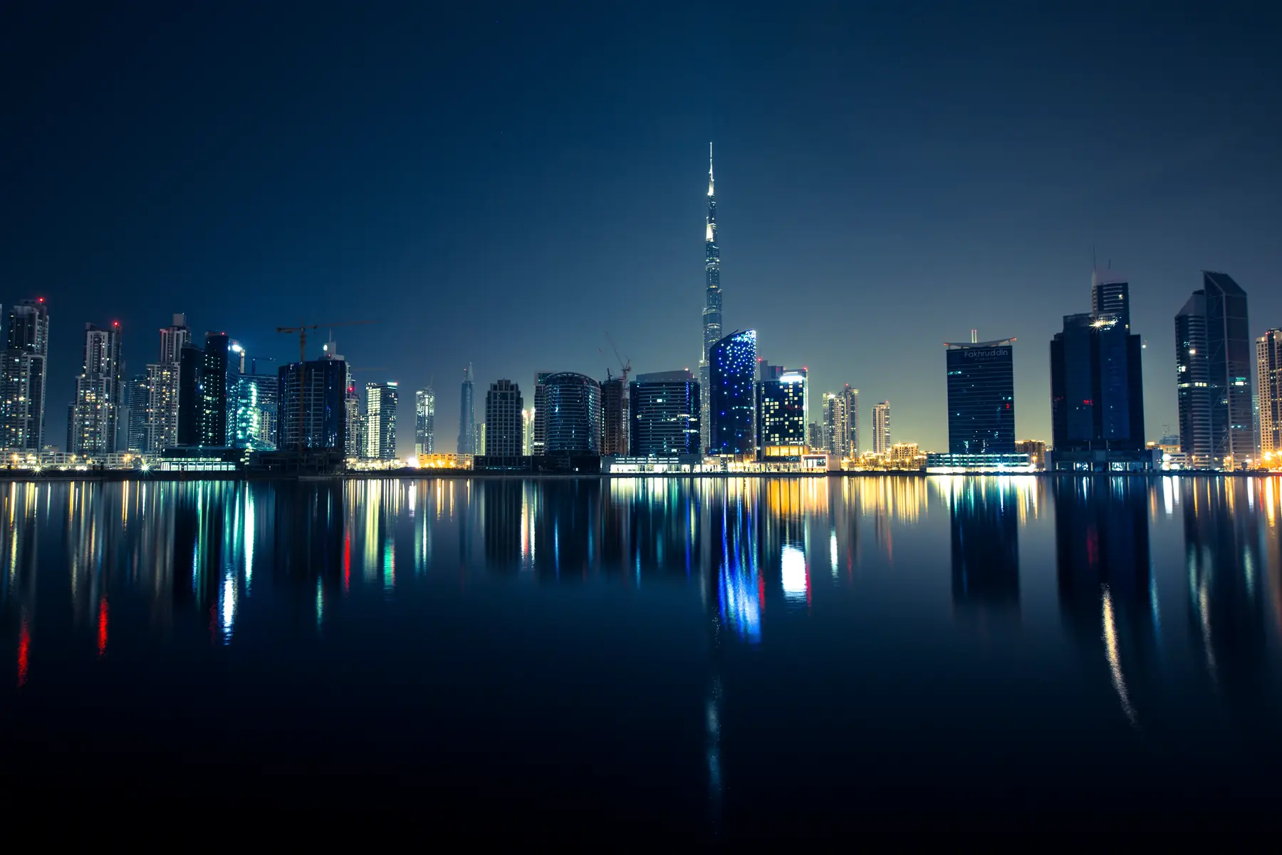 Dubai waterfront skyline lit after dark
