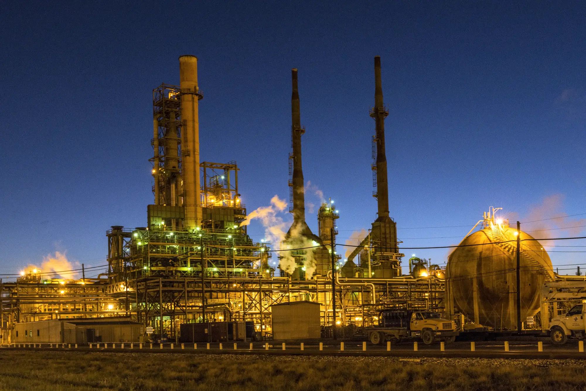 Refinery process units lit at dusk